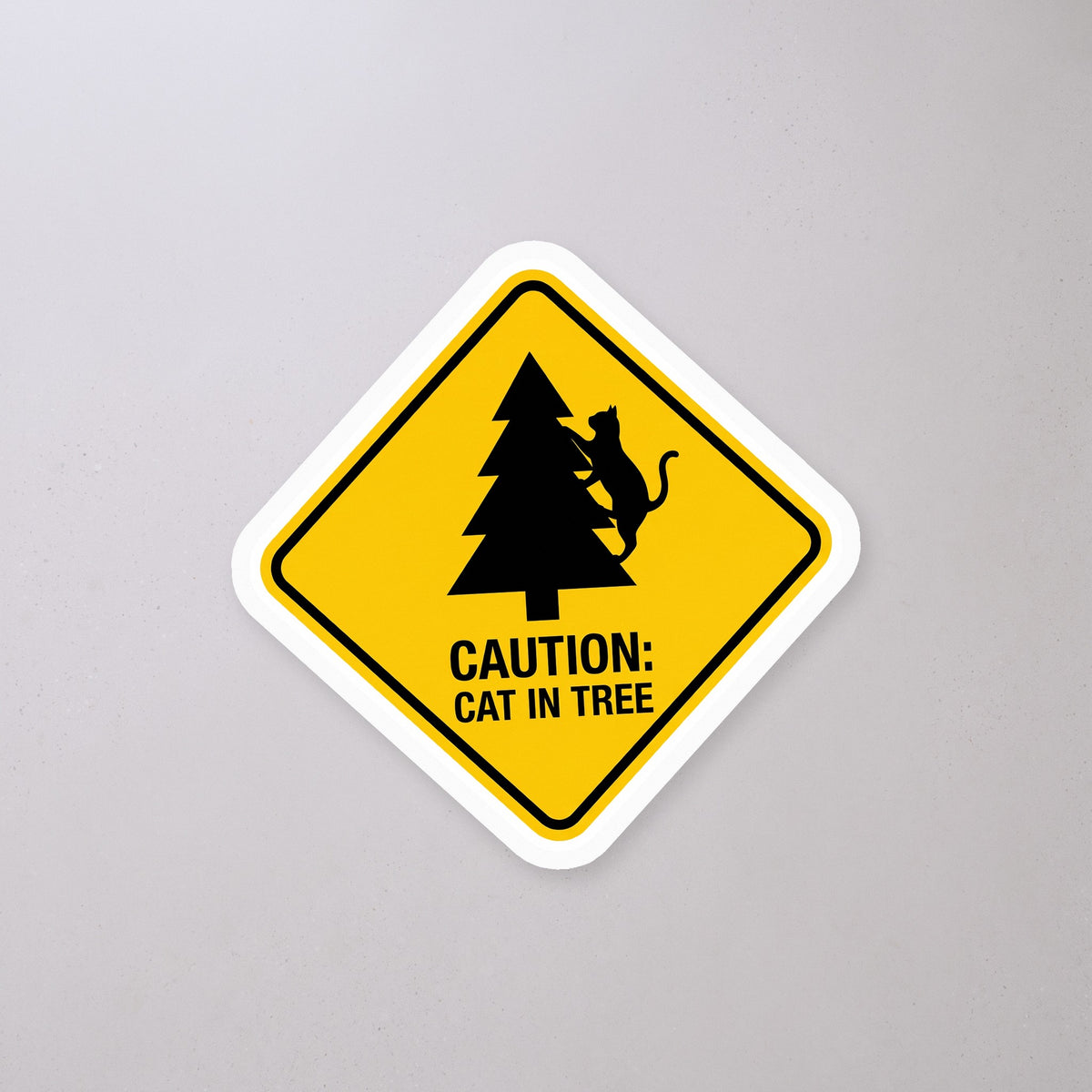 Caution Cat in Tree Sticker on a concrete floor