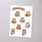Friendsgiving Cat Crew Sticker Sheet, sticker sheet on a concrete floor