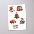 Holiday Reading Cat Sticker Sheet, sticker sheet on a concrete floor