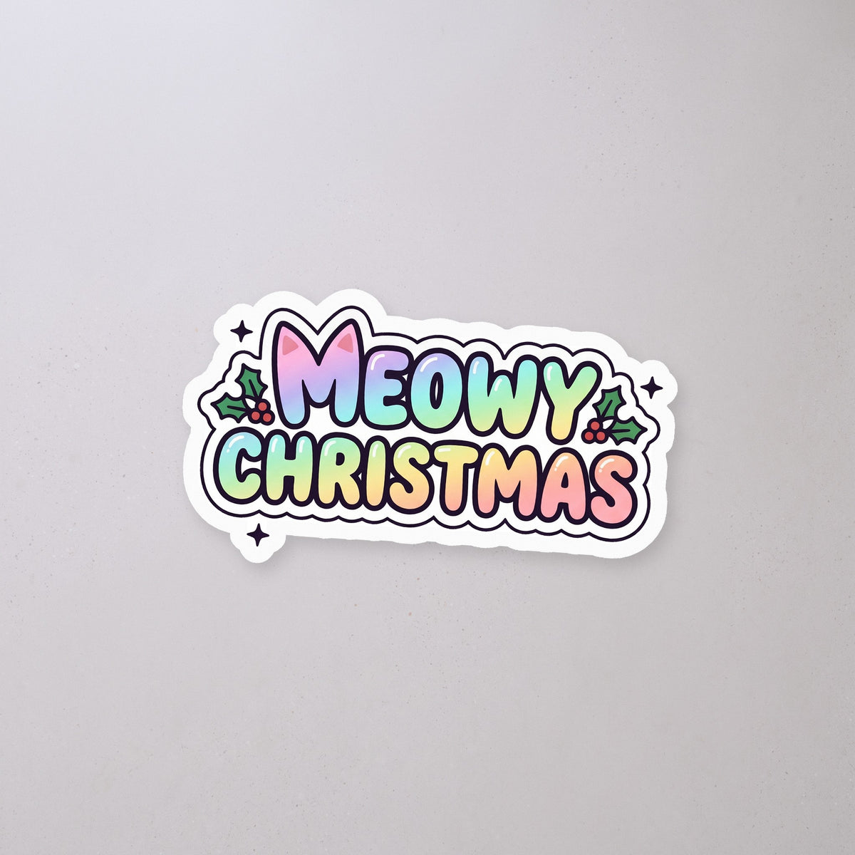 Meowy Christmas Holographic Sticker on a concrete floor