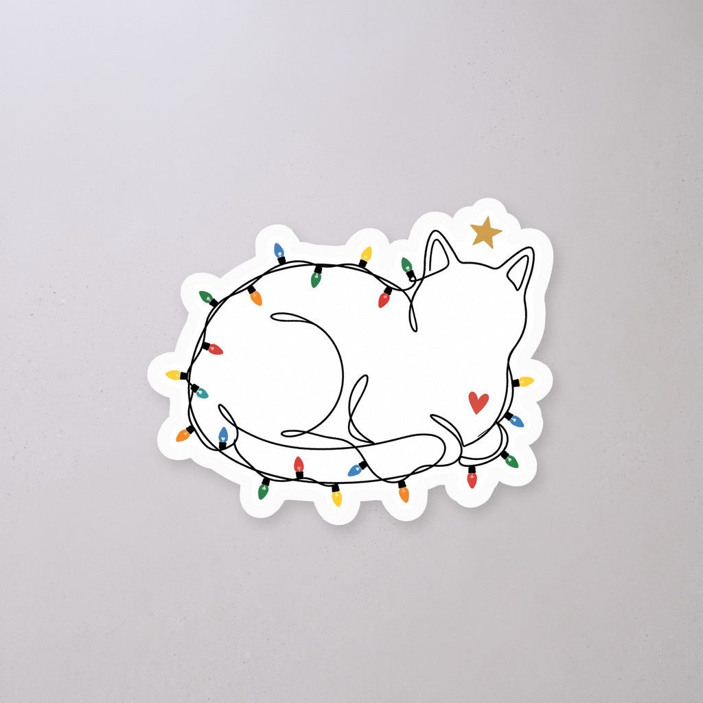 String Light Cat Sticker on a concrete floor