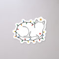 String Light Cat Sticker on a concrete floor