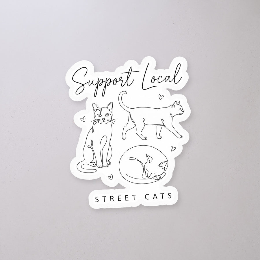 Support Local Street Cats Line Art Sticker on a concrete floor