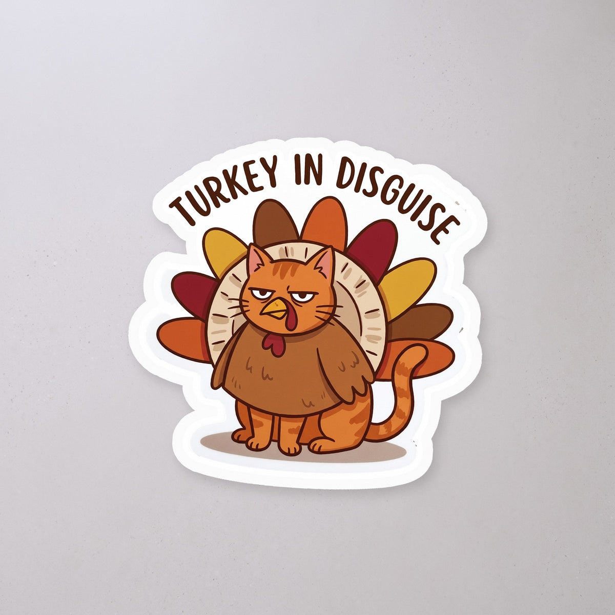 Turkey in Disguise Cat Sticker on a concrete floor
